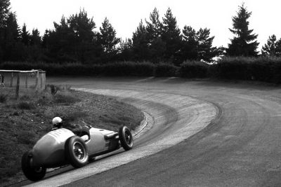 jean-behra-drives-his-gordini-type-16-through-the-karussell-german-grand-prix-nurburgring-august-3-1952